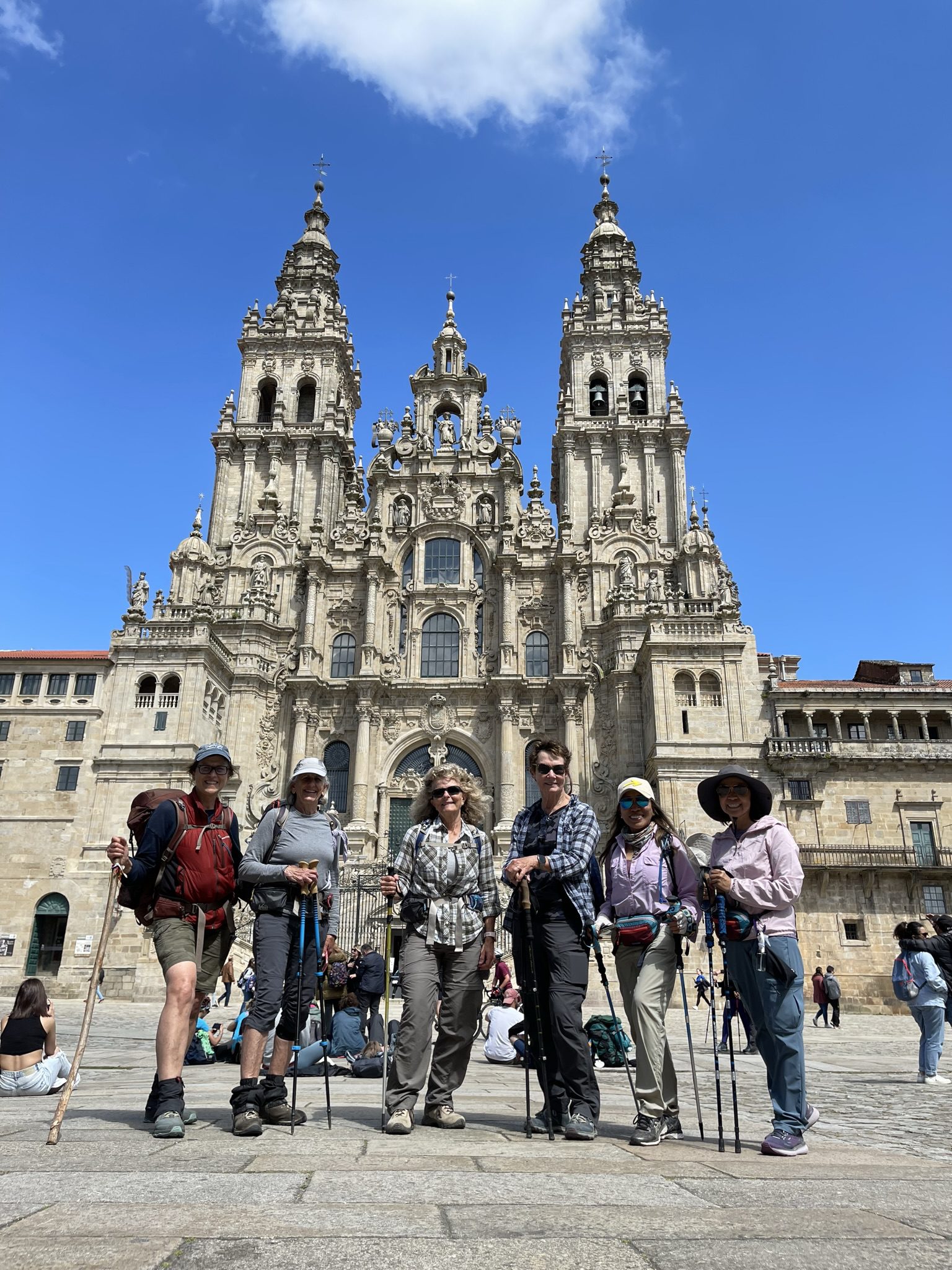 Group of hikers in front of cathedral.