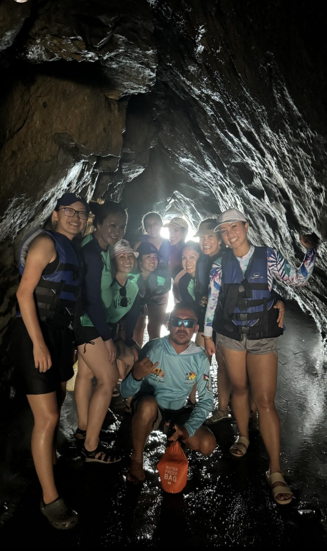 Group adventure inside a dark, rocky cave.