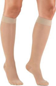 Beige knee-high compression stockings on legs.