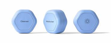 Hexagonal skincare containers labeled cleanser and moisturizer.